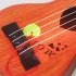 4 Strings Children Simulation Playable Ukulele Guitar Educational Music Instruments Toy Gifts for Beginners brown