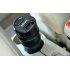 Car cup warmer in a gadgety camera lens style to always keep your drinks warm and as a fun way to trick your friends