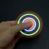 Reduce stress and look cool with this pack of 6 different color hand spinners that have built in LED lights